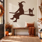 Dark brown witch silhouette riding broom with cat sticker wall decal
