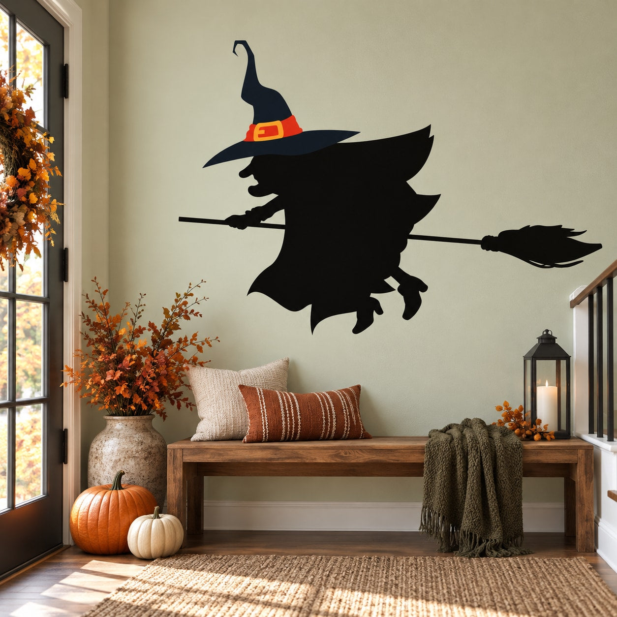 Black witch silhouette with broom, pointed hat and red belt vinyl wall decal