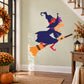 Halloween witch flying on a broom sticker, purple hat and dress, orange broom and boots