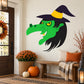 Halloween witch face sticker with oversized green nose and black hat, witchy expression