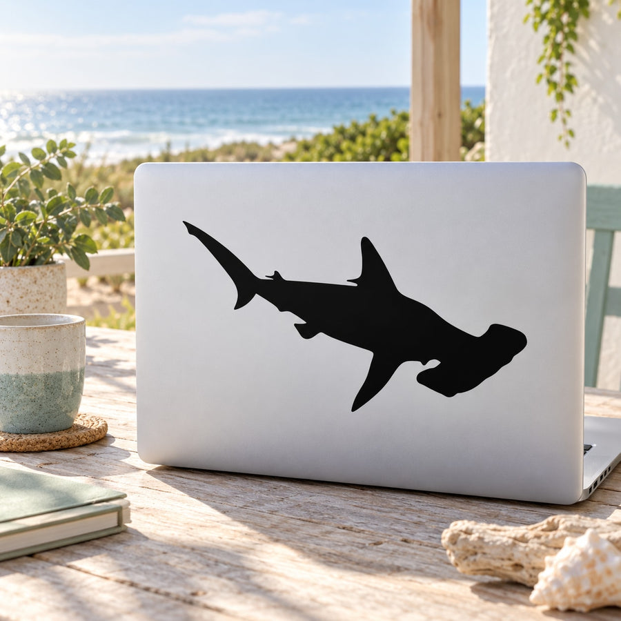 Swimming shark decal with black silhouette on light rectangular surface