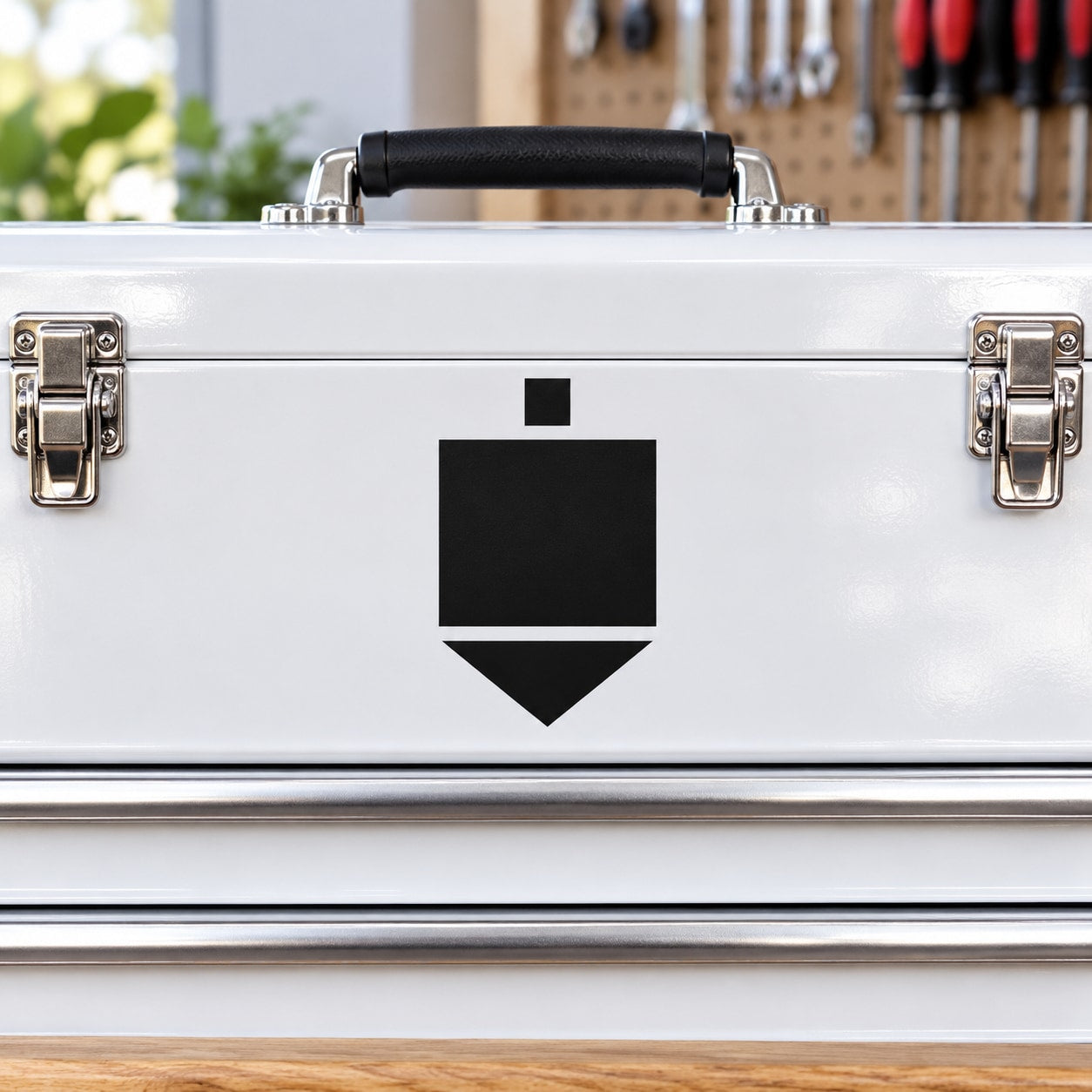 Dreidel decal sticker with black and white symbol on white metal case
