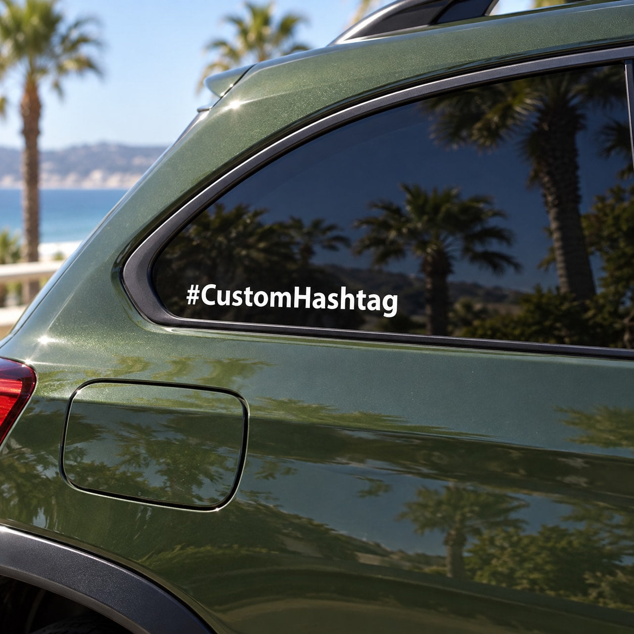 Custom hashtag decal with white “#CustomHashtag” text on a car window