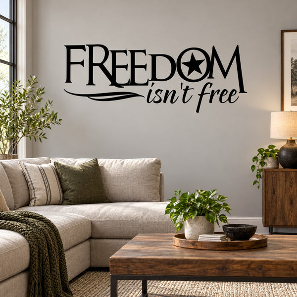 Wall decal with bold black “FREEDOM isn’t free” lettering and a star inside the O