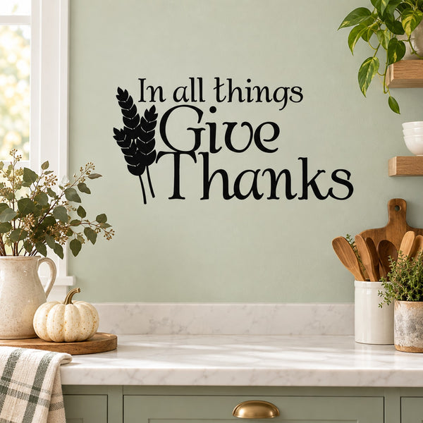 Wall decal with “In all things Give Thanks” script and leaf graphic