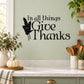 Wall decal with “In all things Give Thanks” script and leaf graphic