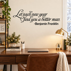 Black cursive quote wall decal: “Let each new year find you a better man.”