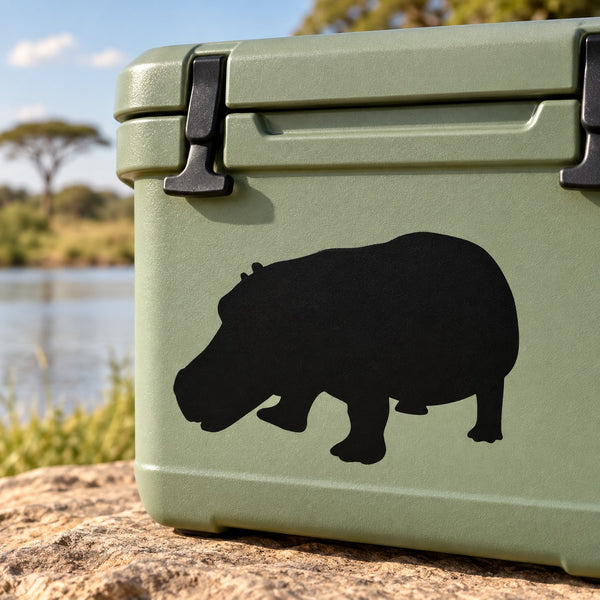 Black grazing hippo decal sticker on green surface
