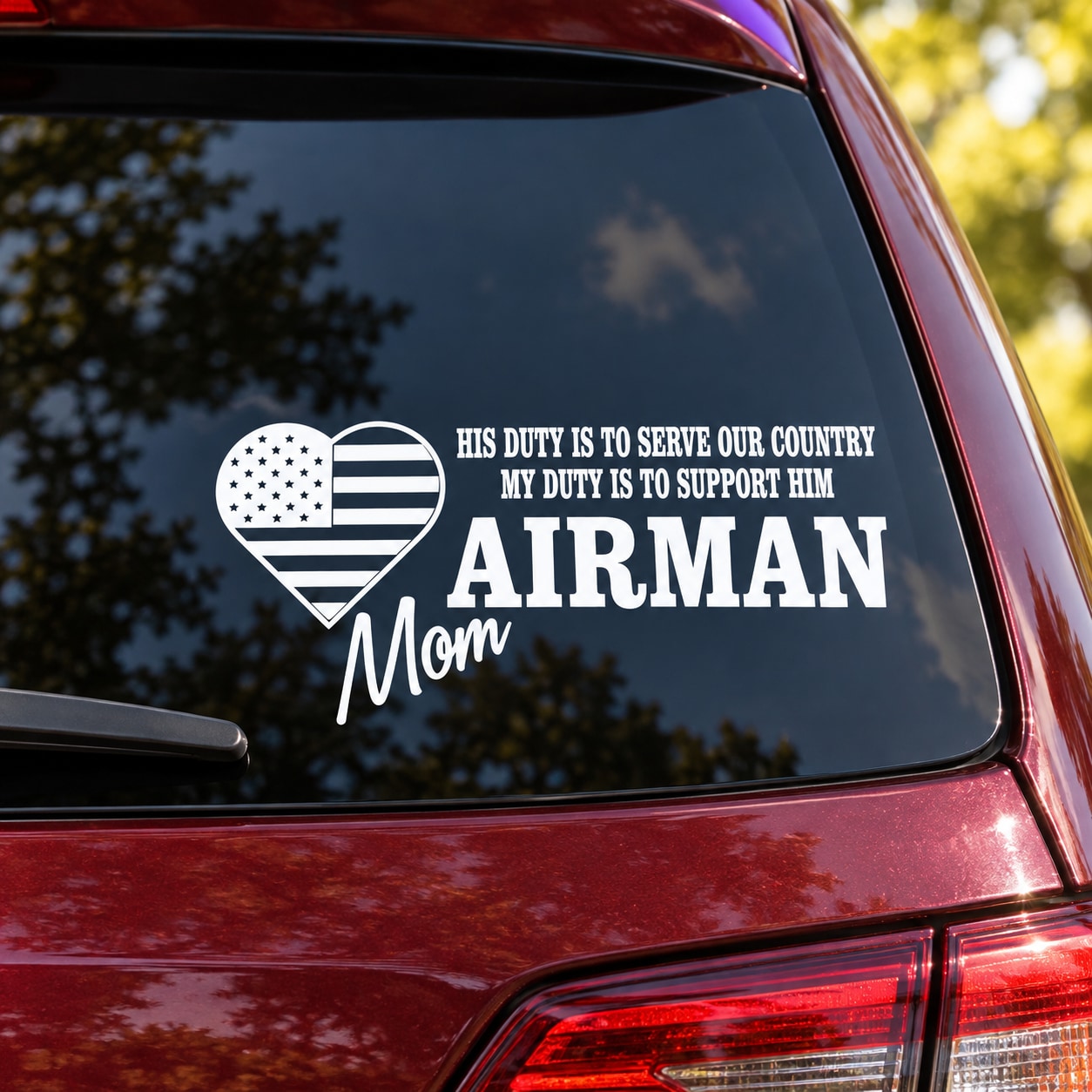 Airman Mom duty decal with heart U.S. flag icon and 'Airman Mom' text on car window
