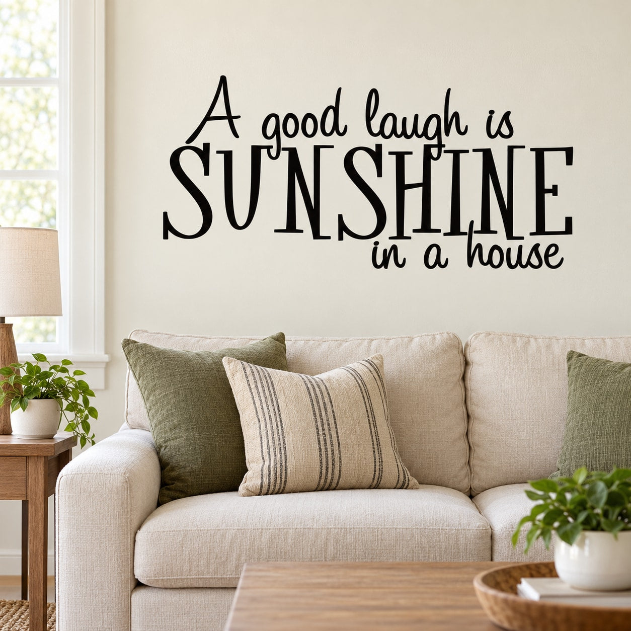Wall decal text: “A good laugh is sunshine in a house” with large “SUNSHINE”