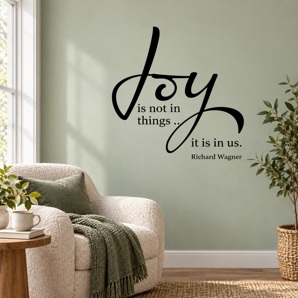 Wall decal with cursive text: “Joy is not in things, it is in us” by Richard Wagner