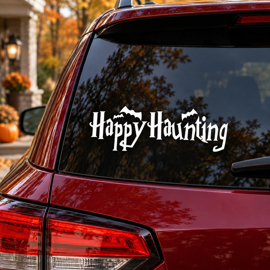 Halloween happy haunting decal with white spooky text on dark surface