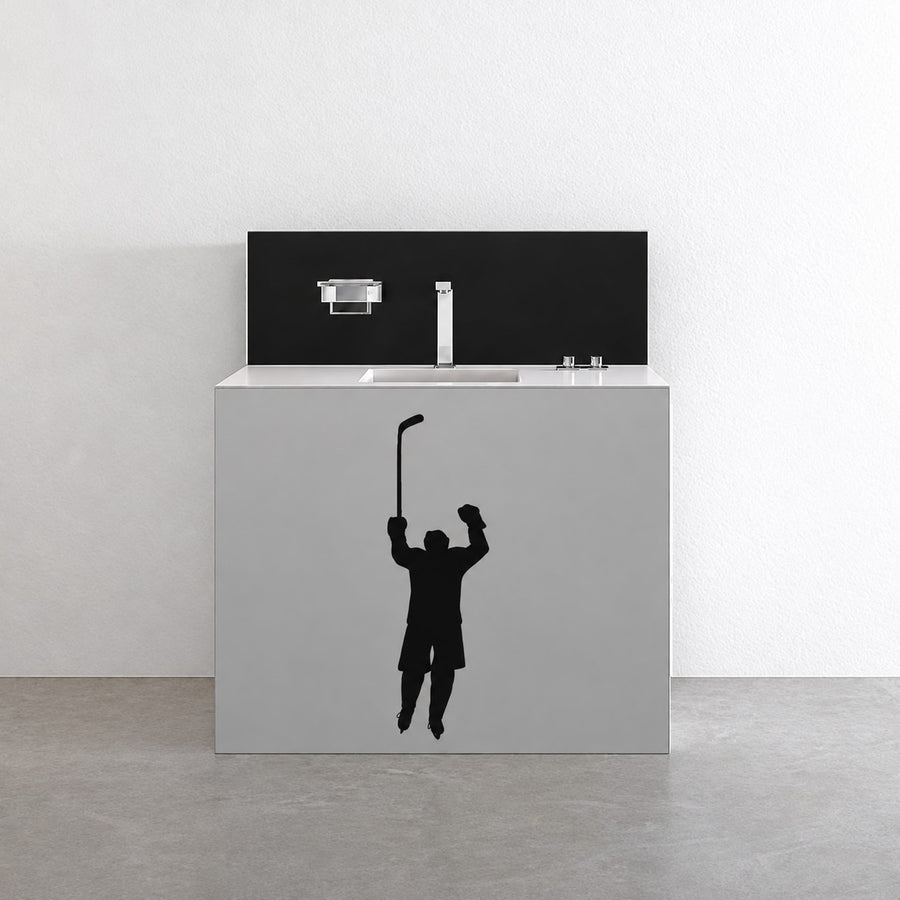 Black hockey player decal with arms raised and goal stick silhouette