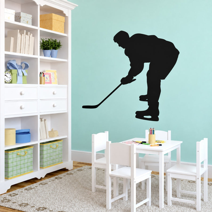 Black hockey player silhouette vinyl decal with hockey stick