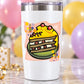 Cake sticker on white tumbler, cartoon slice with sprinkles.