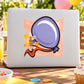 Purple floating balloon sticker with confetti and ribbon banner on a light surface