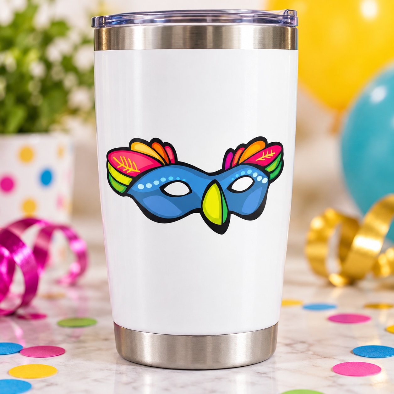 White tumbler with colorful masquerade mask sticker, neon feathers and green nose