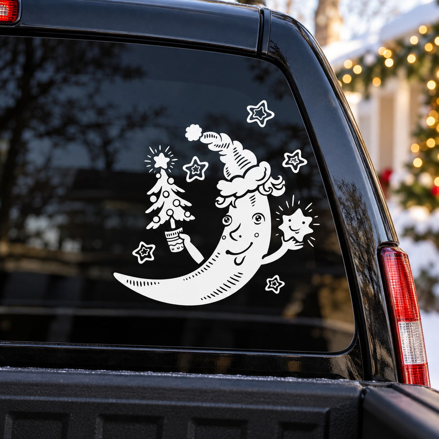 Christmas moon car decal with moon, stars, tree, and angel silhouettes in white