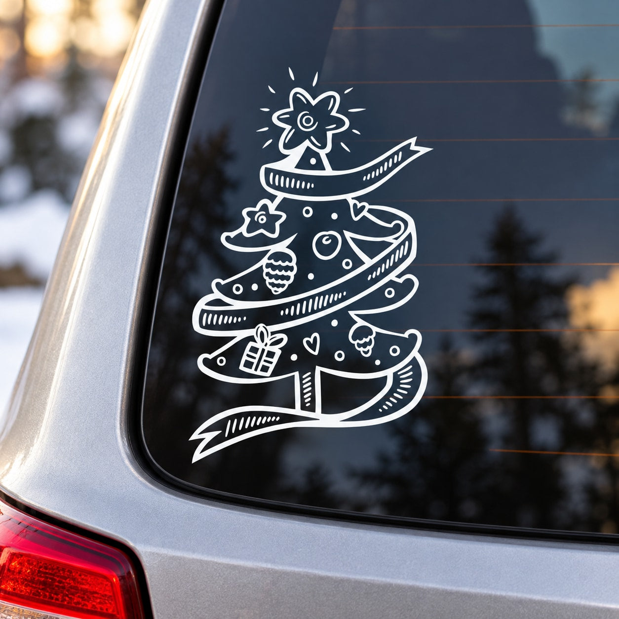 Christmas tree ribbon decal with white outline on dark car window