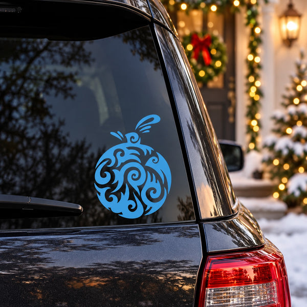 Blue abstract round vinyl decal with swirling ornament on window