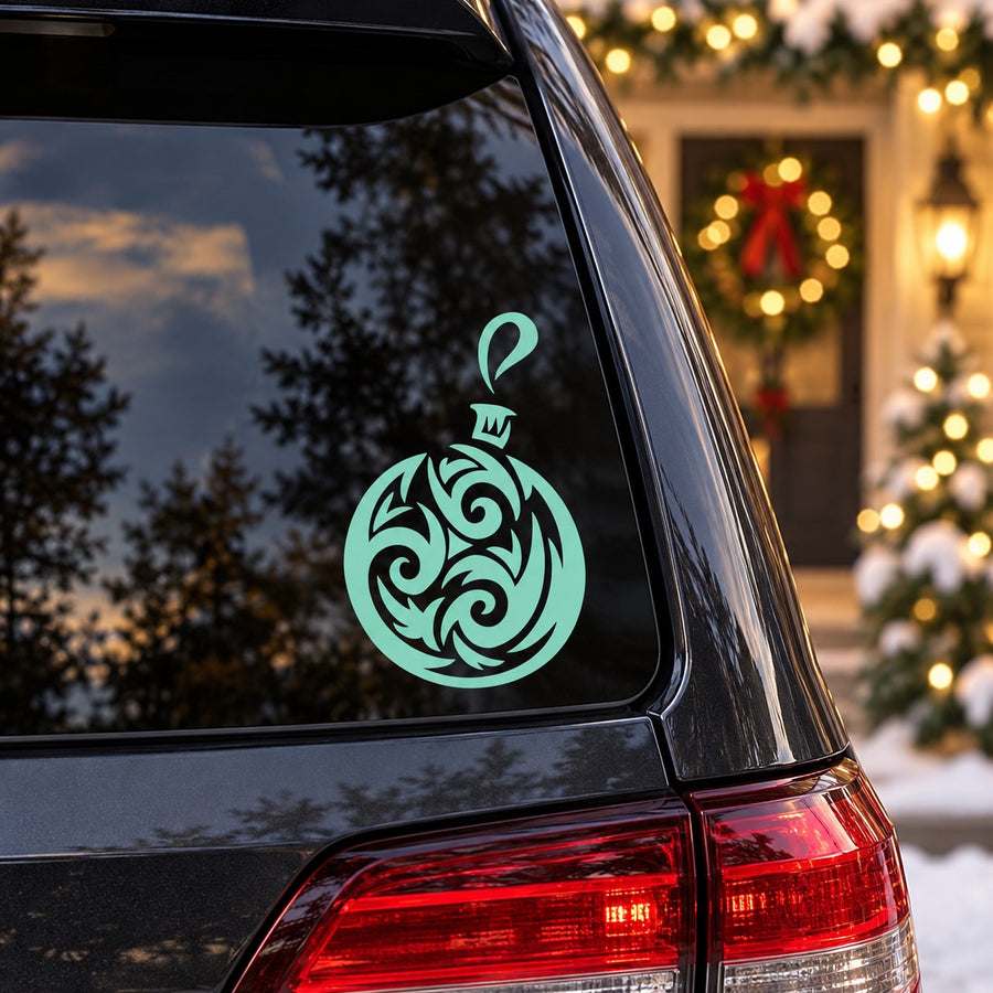 Green swirl Christmas ornament vinyl wall decal on dark window glass