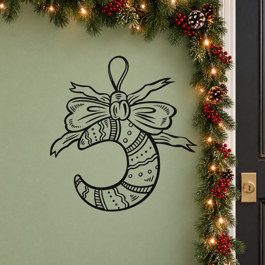 Santa Claus wall decal: black vinyl outline of Santa head with bow and hat