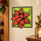Square gift bow sticker with orange and red bow on green patterned background