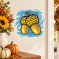 Thanksgiving acorns sticker with two cartoon acorns on blue watercolor splash