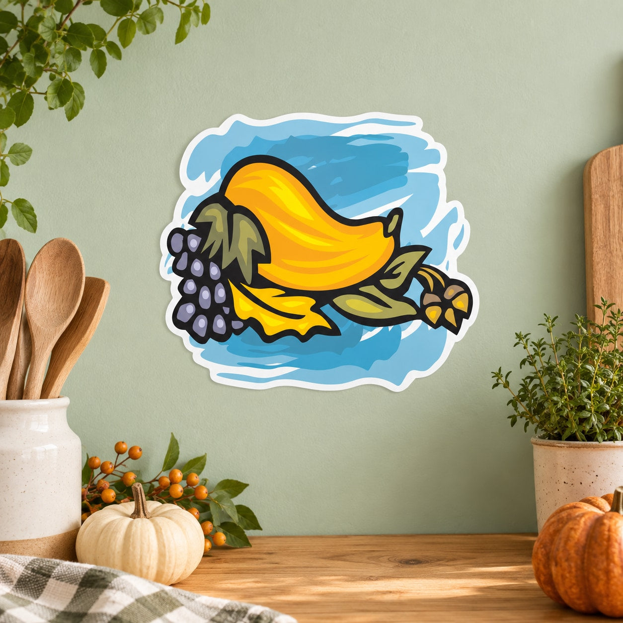 Colorful illustrated sticker of a yellow bird with grapes on a blue splash border