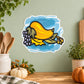 Colorful illustrated sticker of a yellow bird with grapes on a blue splash border