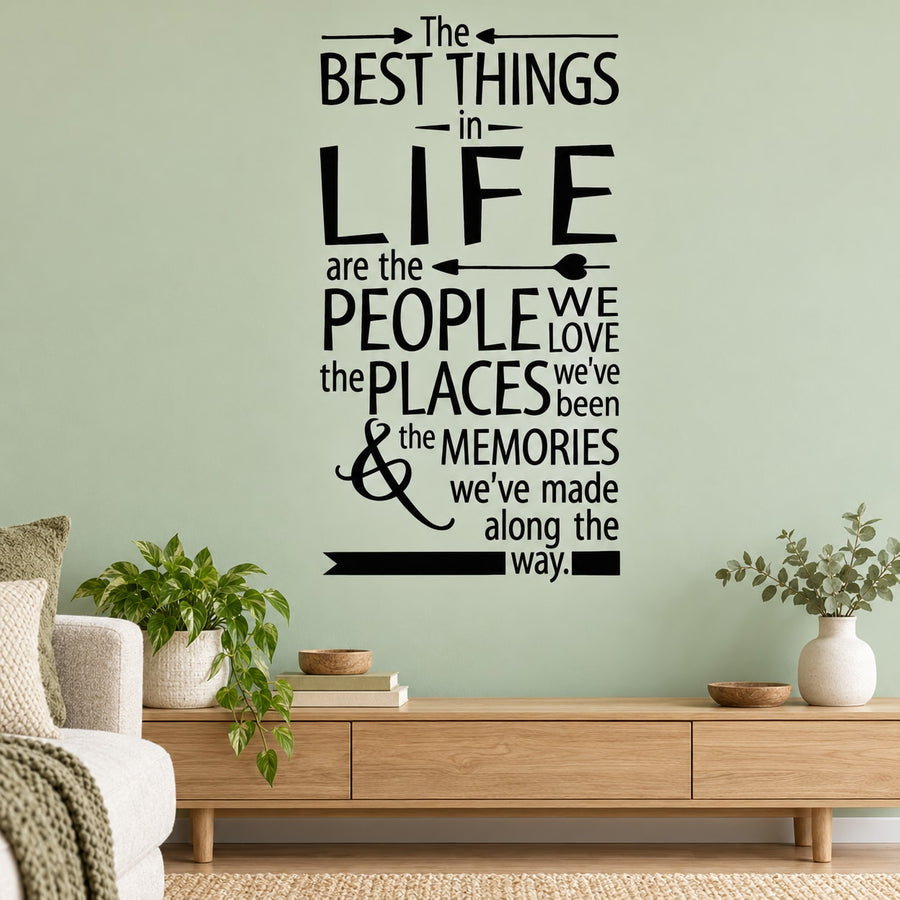 Black wall decal with typographic quote: “The best things in life are the people we love”.