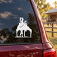 White horse trotting with wagon decal on a red car window