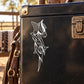 Abstract graffiti horse head decal with white outline on dark surface