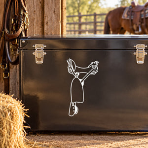 Cowboy saddle decal with white outline of a rider holding reins on dark surface