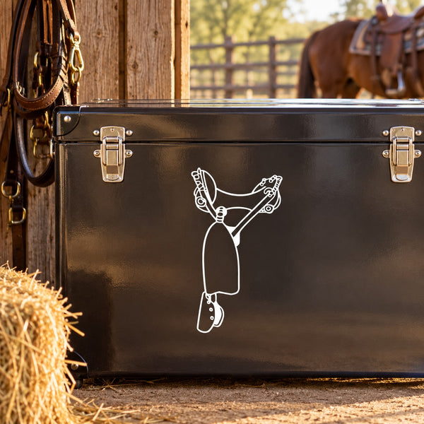 Cowboy saddle decal with white outline of a rider holding reins on dark surface