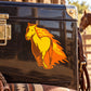 Yellow and orange galloping horse sticker with flame details on dark surface