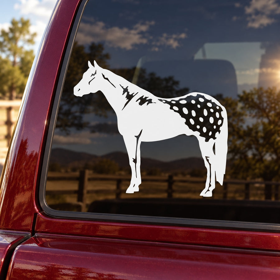 White standing horse decal with speckled coat on car window