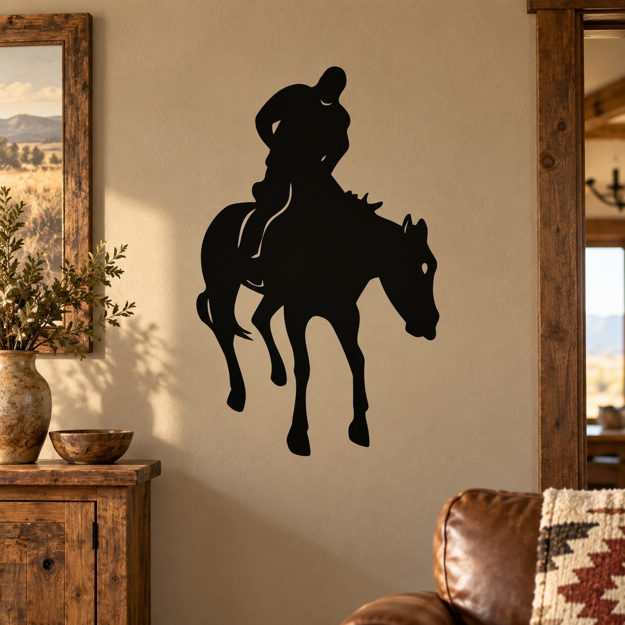 Cowboy riding horse jumping vinyl decal, black silhouette