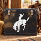 Cowboy riding horse bucking decal with white silhouette on dark black surface