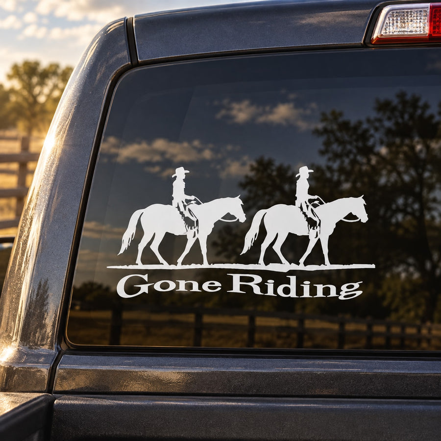 White car window decal with two strolling horses and “Gone Riding” lettering