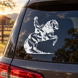 Horse-and-girl decal sticker on dark car window glass