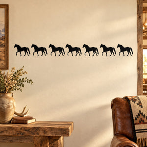 Row of seven black horse silhouettes decal