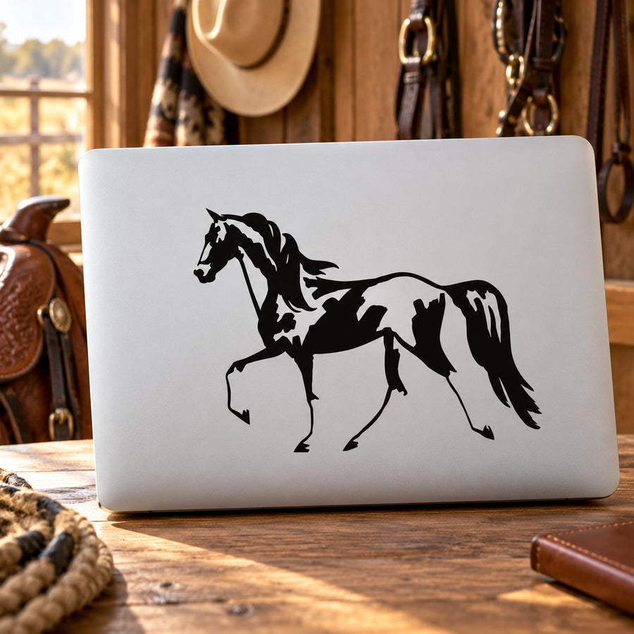 Black horse silhouette decal with rider graphic on white surface