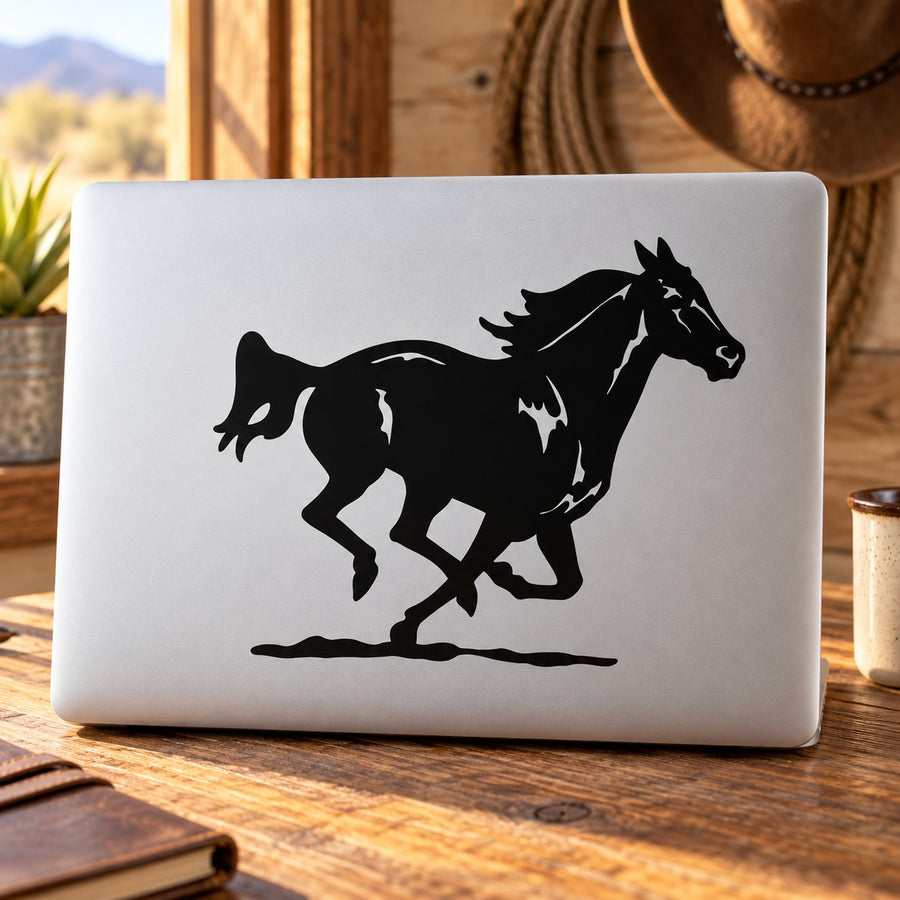 Black galloping horse silhouette decal on white surface