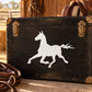 White running horse decal silhouette on dark luggage trunk