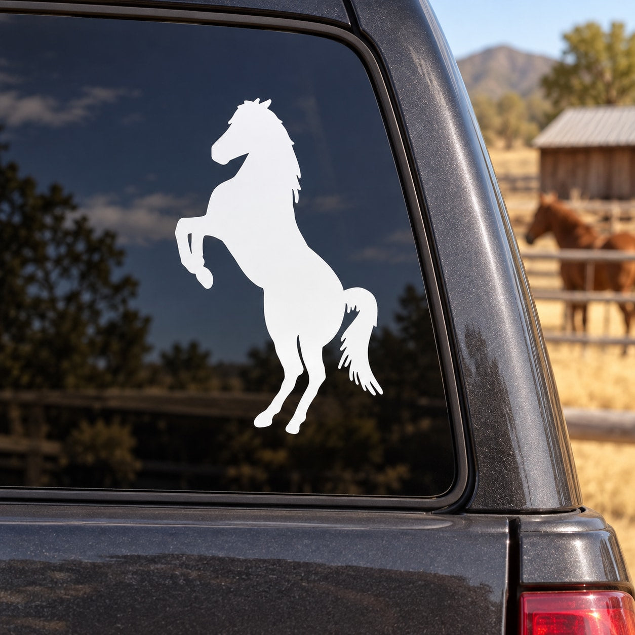 Standing stallion decal with white horse silhouette on car window glass