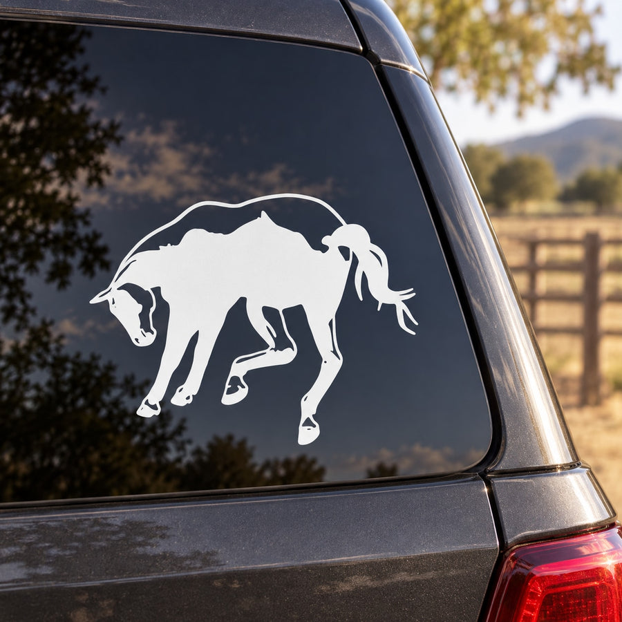 Kicking Horse decal with white kicking horse graphic on car window