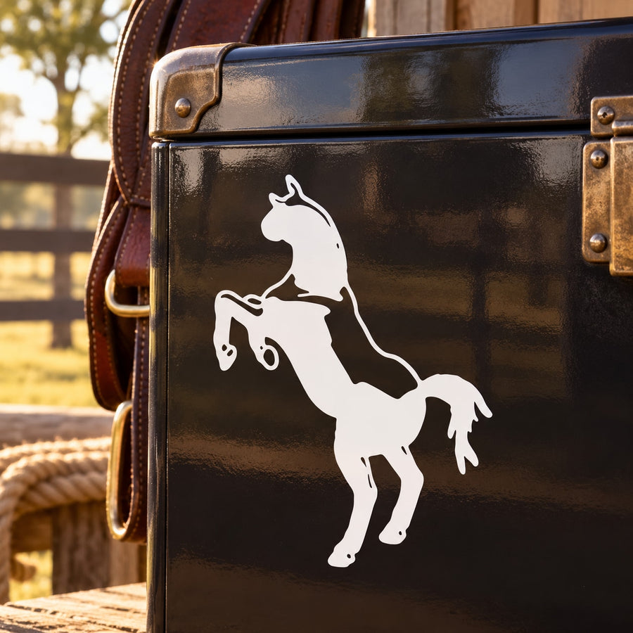 White standing horse facing decal on a dark glossy surface