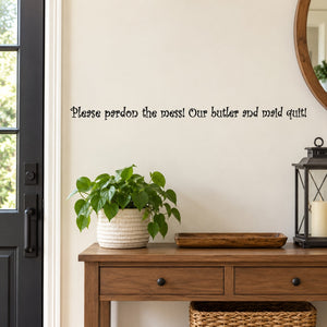 Wall decal with quote: “Please pardon the mess! Our butler and maid quit!”