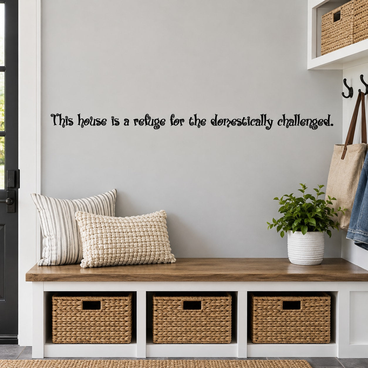 Wall decal text: “This house is a refuge for the domestically challenged.”
